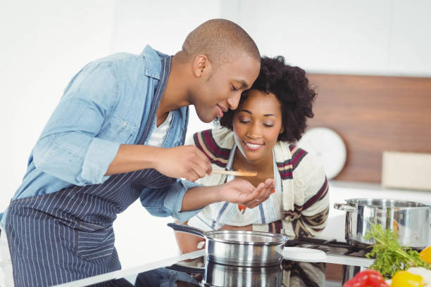 istock Happy couple cooking together 851560412
