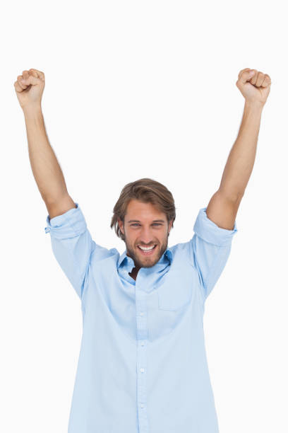 istock Happy man celebrating success with arms up 851561814
