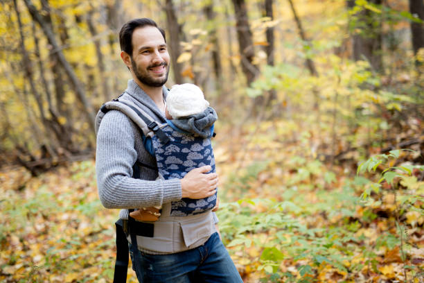istock Father with daughter baby in autumn forest 851562442