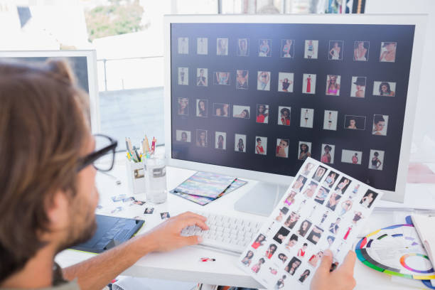 istock Photo editor working on the contact sheet 851564838