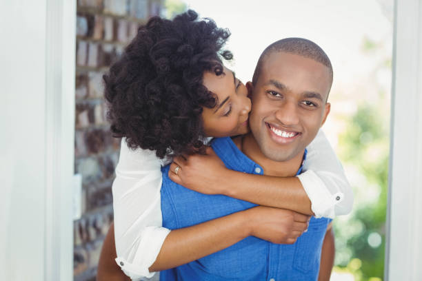 istock Handsome man giving piggy back to his girlfriend 851565684