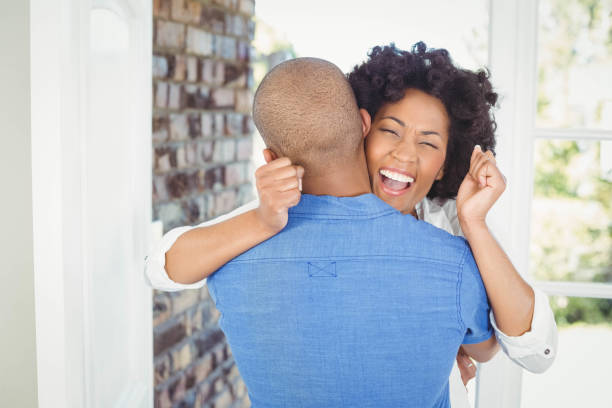 istock Happy couple embracing and cheering 851565970