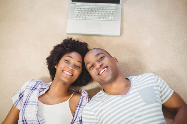 istock Happy couple lying on the floor 851566296