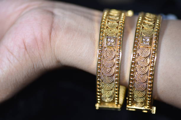 istock Fancy gold looking imitation bangles / bracelets on the woman's wrist 851566920
