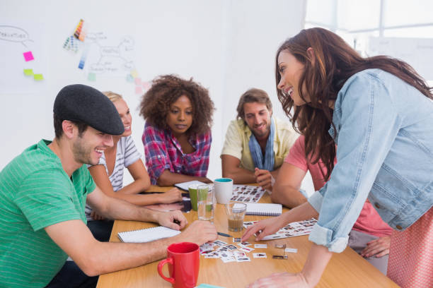 istock Editor picking photographs in a meeting 851573330
