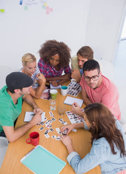 istock Editors choosing photographs in a meeting 851573496