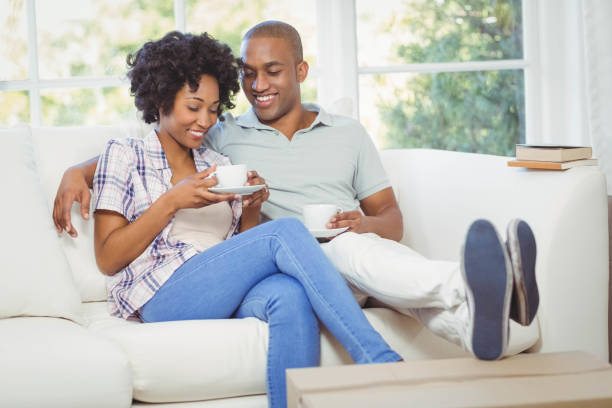 istock Happy couple on the sofa drinking coffee 851574154