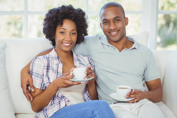 istock Happy couple on the sofa drinking coffee 851574264