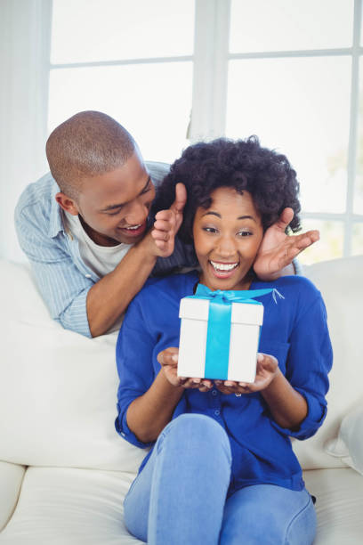 istock Surprised woman looking at gift on her hands 851579344