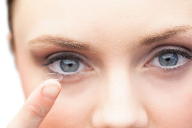 istock Pretty model holding contact lens 851579996