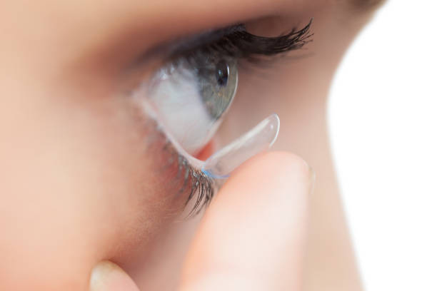 istock Extreme close up on young model applying contact lens 851580126
