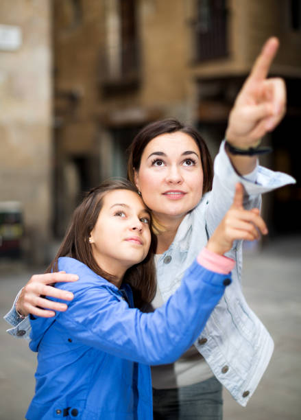 istock Mother and daughter pointing at sight during 851580270