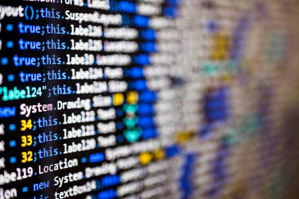 Program source code on black background close-up concept Software source code on black background photo taken from a computer monitor. extensible markup language photos stock pictures, royalty-free photos & images