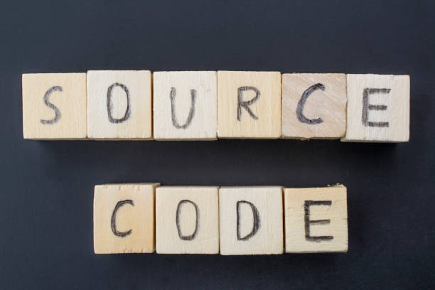 Source Code concept close-up Wooden cubes on a beautiful black background with Source Code written on hand. extensible markup language photos stock pictures, royalty-free photos & images