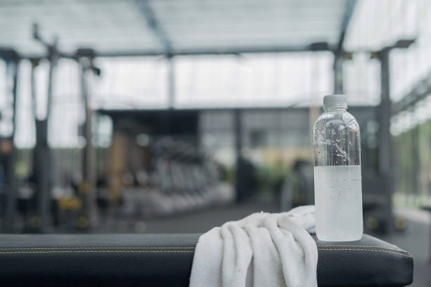 istock Fitness background with bottled water in gym 851584664