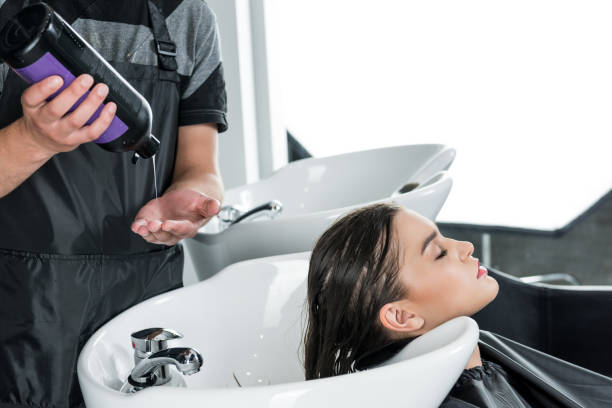 istock woman having hair wash 851585286