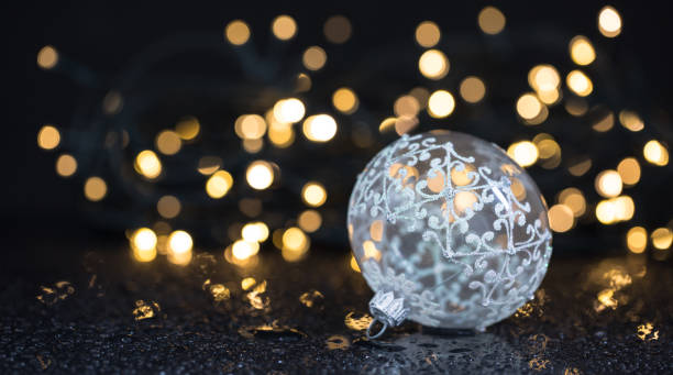 istock Shiny christmas ornament / decorations / christmas lights on black background. 851585518