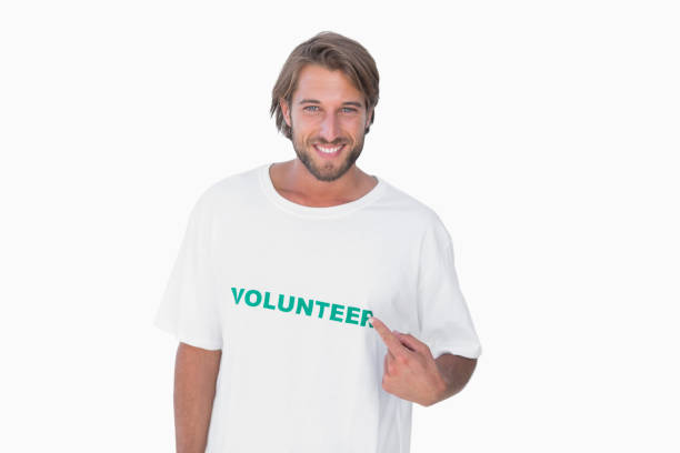 istock Smiling man pointing to his volunteer tshirt 851585946