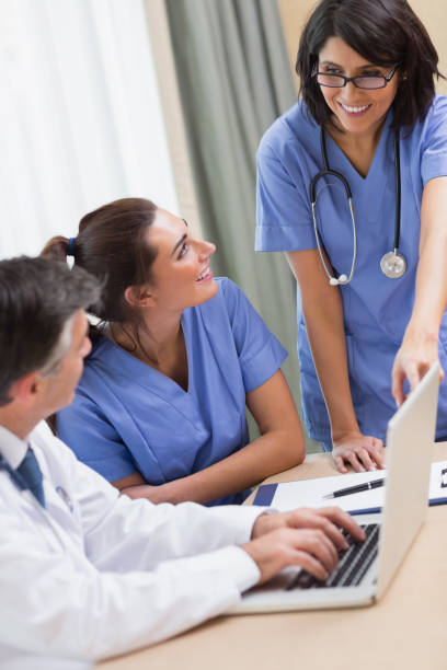 istock Nurse pointing to something on laptop 851589564