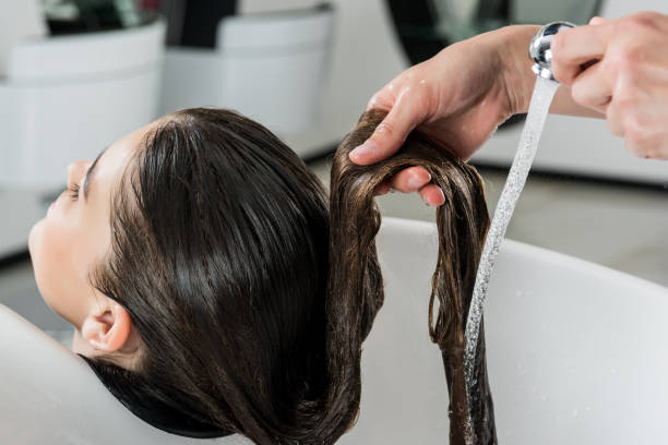 istock woman having hair wash 851589594