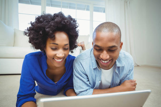 istock Smiling couple lying on the floor 851589660