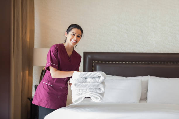 istock Happy maid working in hotel room 851590372