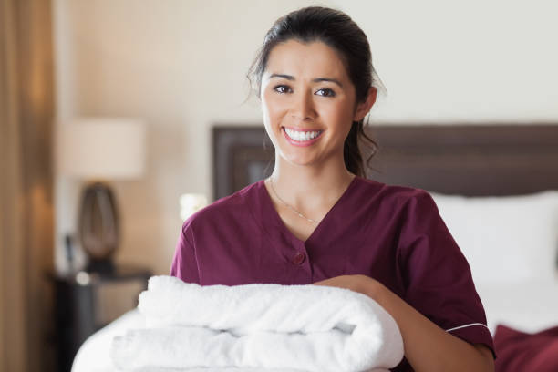 Happy maid with towels