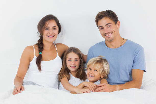 istock Family sitting on the bed 851629188