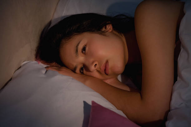 istock Young asian woman suffering from insomnia 851629518