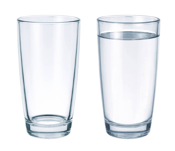 istock Empty glass and glass with water isolated on white background 851634546