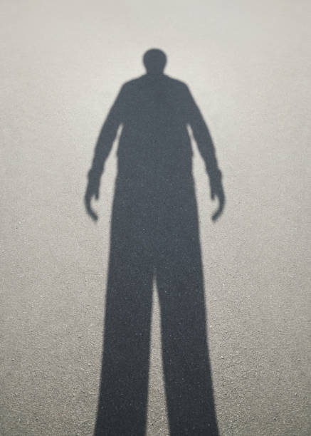istock Shadow of man on the asphalt 851634680