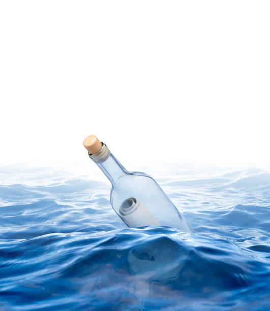 istock Bottle with a letter swims in the sea 851634768
