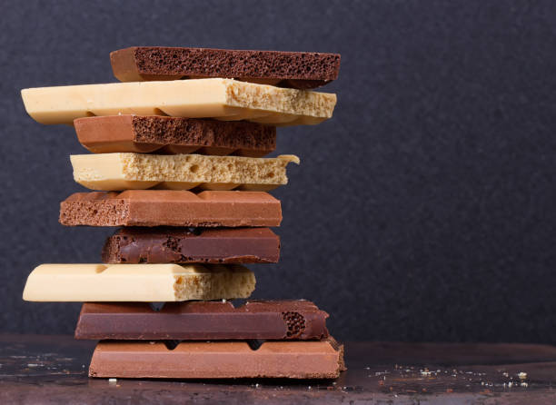 stack of different kind porous chocolate pieces - friable imagens e fotografias de stock