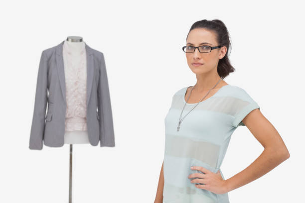 istock Fashion designer posing beside clothes mannequin 851660628