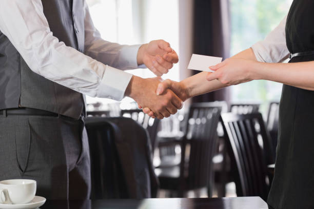 istock Busines people shaking hands after meeting and changing cards 851665082