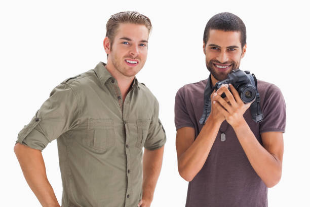 istock Stylish friends smiling with one holding camera 851665894