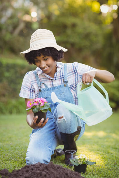 istock Smiling woman crouching in the garden 851666000