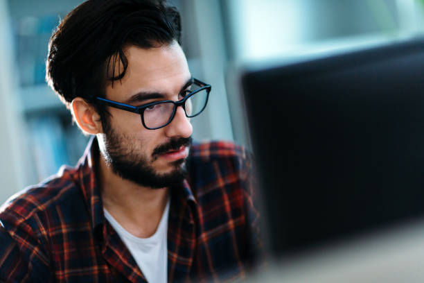 istock Portrait of young programmer working in office 851672118