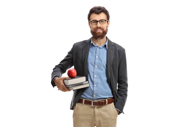 Teacher with an apple and books looking at the camera isolated on white background