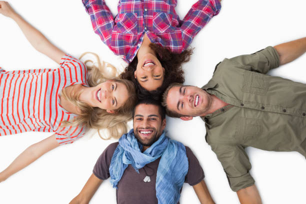 istock Friends lying in a circle and smiling at camera 851674850