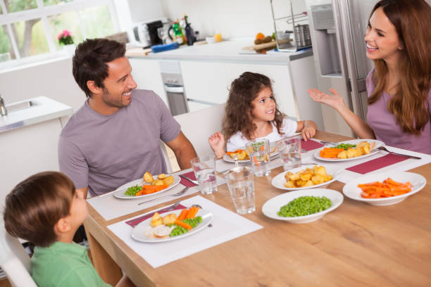 istock Family talking around the dinner table 851675108