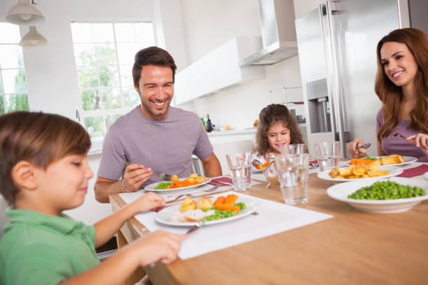 istock Family smiling around a good meal 851675164