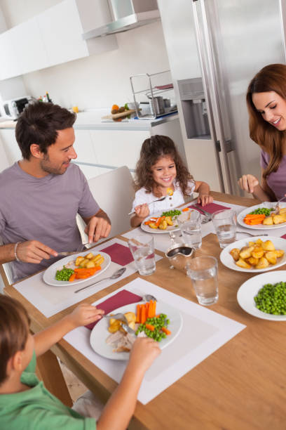 istock Family eating healthy dinner 851675192