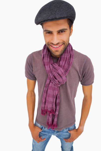 istock Smiling man wearing peaked cap and scarf 851676496