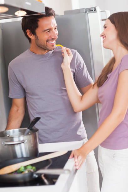 istock Woman feeding man with a yellow pepper 851676532
