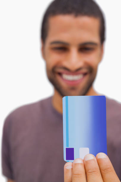 istock Handsome man holding credit card 851680330