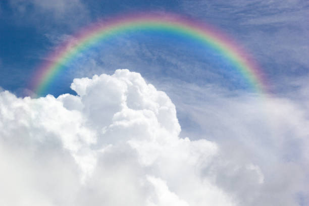 beautiful classic rainbow across in the blue sky after the rain, rainbow is a natural phenomenon that occurs after rain. - lpn imagens e fotografias de stock