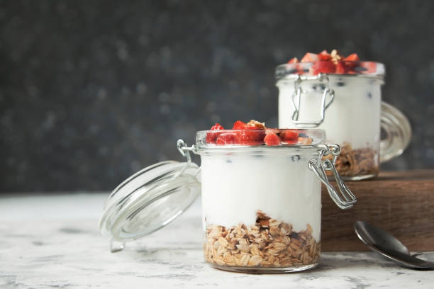 istock Granola with yogurt and berries in jars 851686184