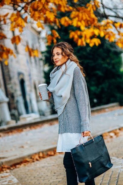istock Woman drinking coffee outdoors 851694374