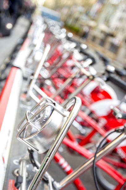 istock Bicycles stand in a row on a parking for rent. 851695212
